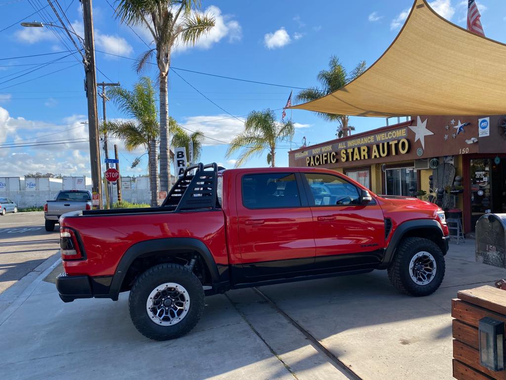 Red Dodge Ram truck finished and parked at the shop